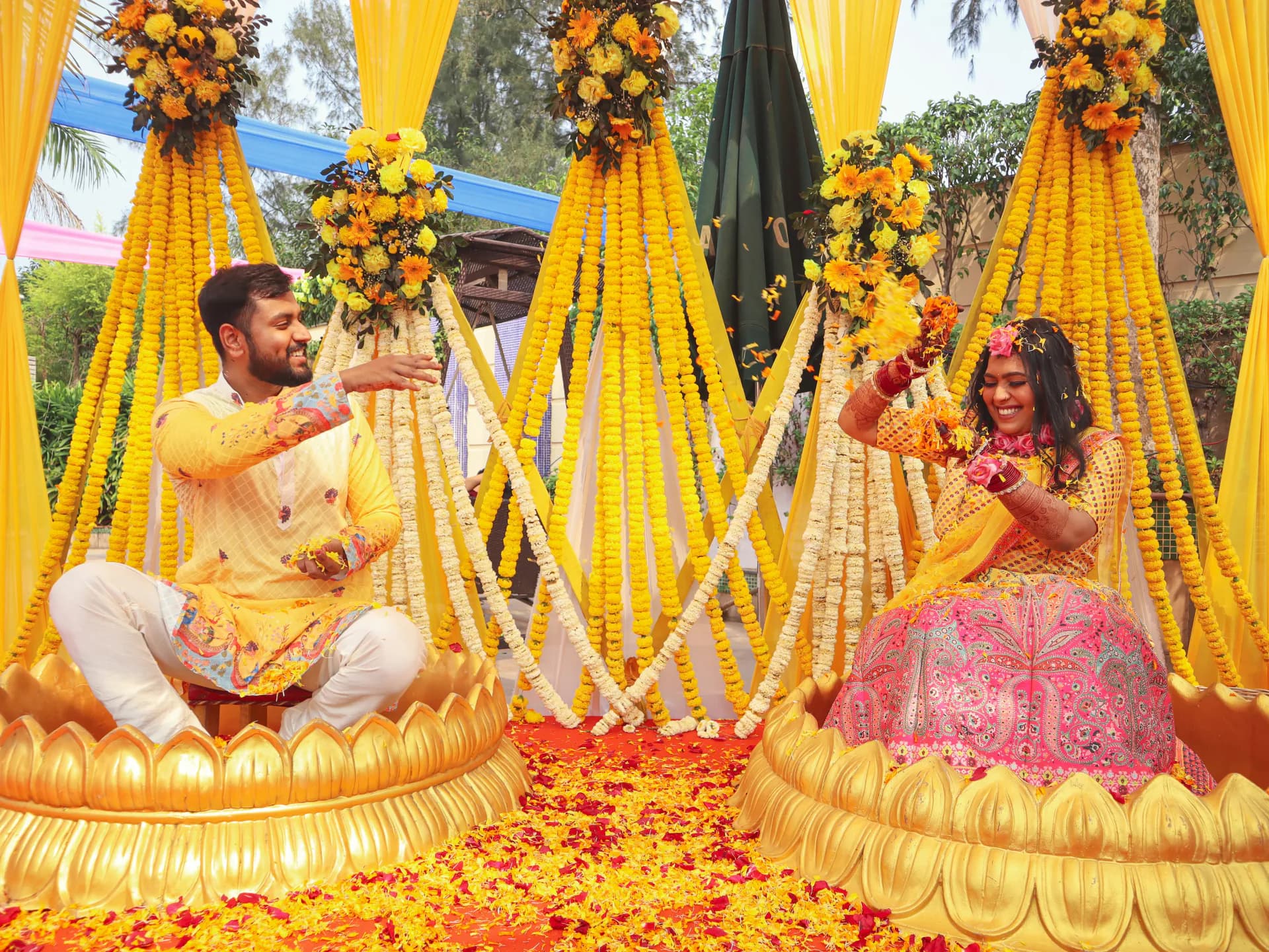 Couple surrounded by yellow flower petals