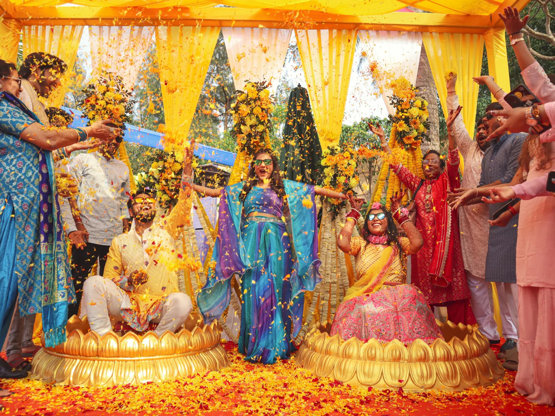 Bride and Groom celebrating Haldi with family