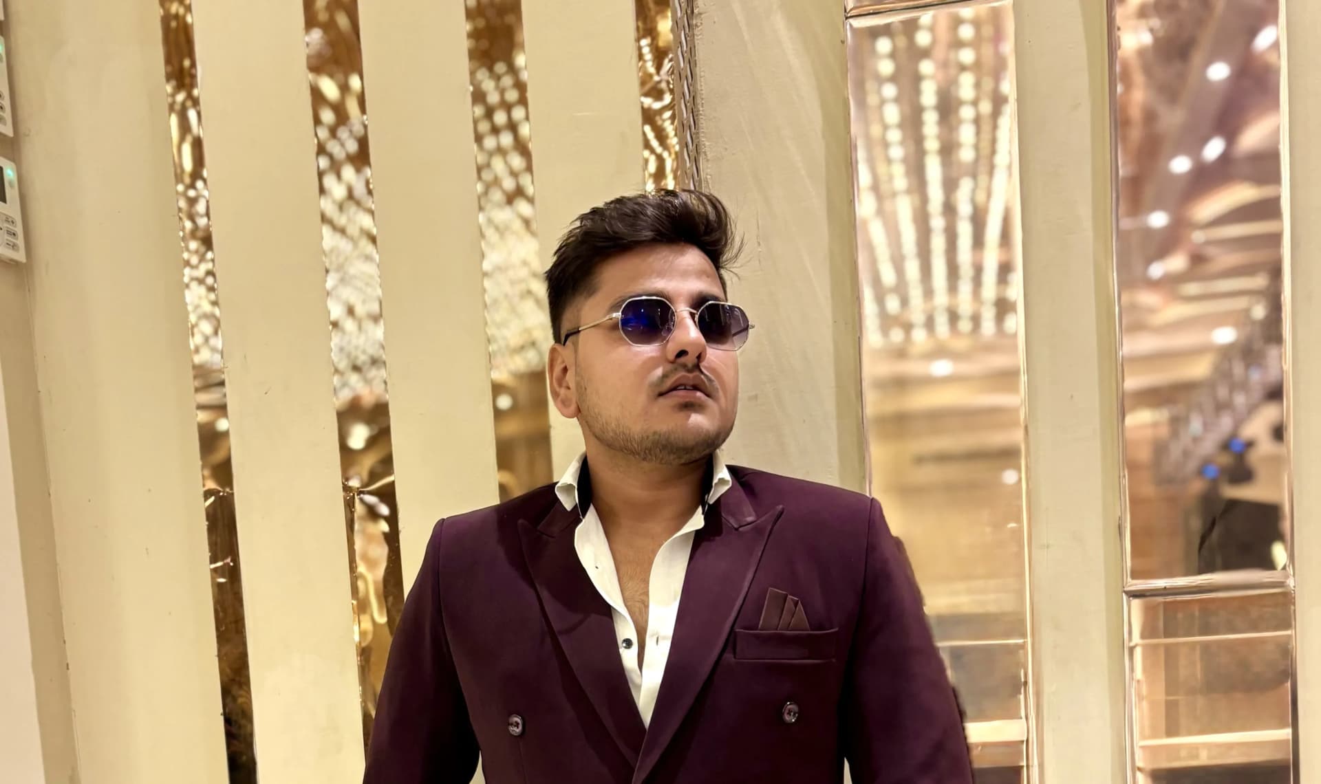 Anchor Yash Soni hosting a premium live event on stage