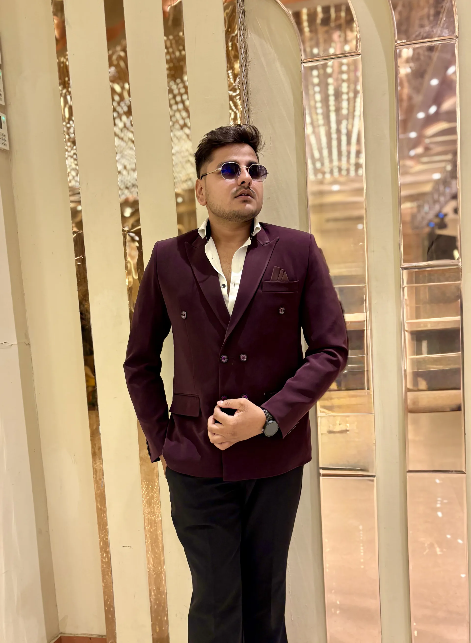 Anchor Yash Soni in a professional portrait, suited up for a premium event